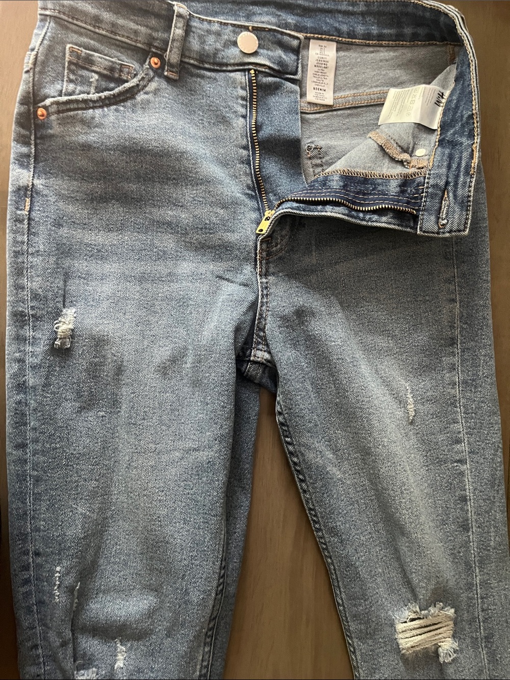 H&M woman’s Light Blue Slim Straight Jeans with Ripped Detail